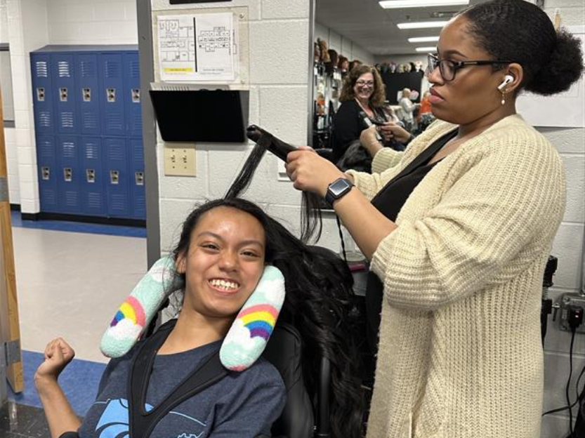 Centennial High cosmetology students style hair